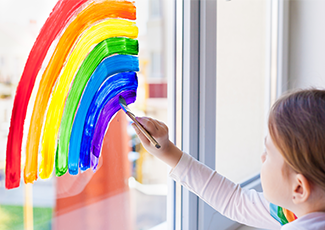 child painting a rainbow