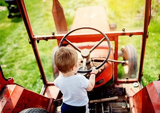 Child driving a tractor.